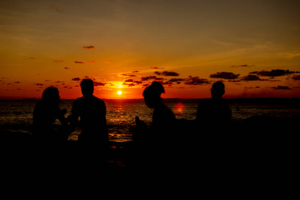 istock Silhouette of people against romantic and beautiful sunset. 1752393449