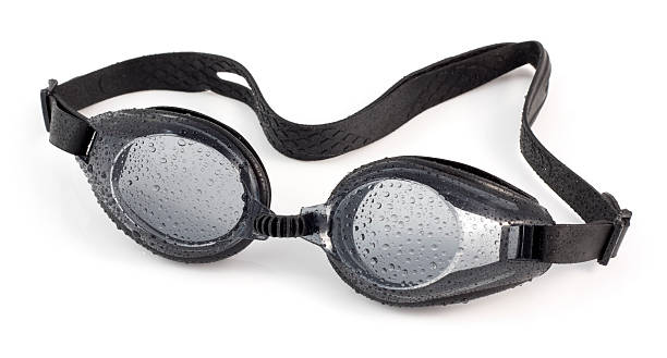 Black swimming goggles isolated on a white background Swimming goggles on a white background. swimming protection stock pictures, royalty-free photos & images