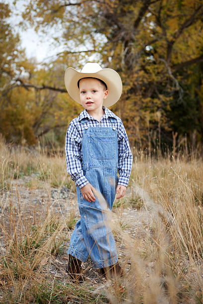 istock Little Boy Wearing Denim Overalls and Cowboy Hat 175239512