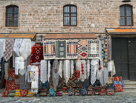Carpets displayed for sale in a bazaar in Korche, Albania.