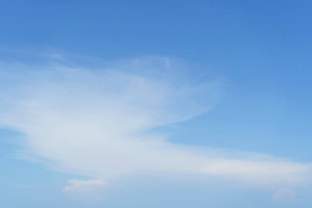 View of dense, heavy, big clouds and blue sky.