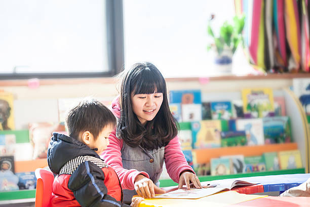 istock teacher and child in classroom 175240124