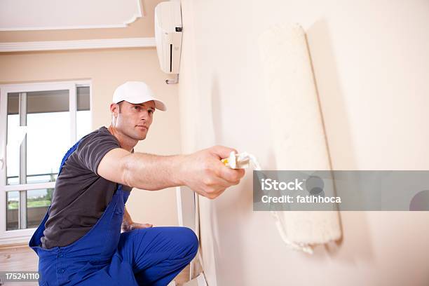 House Painter Primes Interior Wall Stock Photo - Download Image Now - House Painter, Expertise, Paint Roller