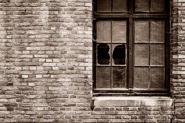 istock Derelict Brick Building Exterior with Broken Windows 175241186