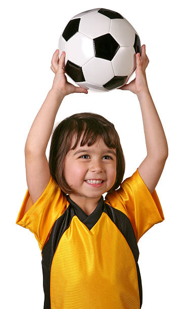 istock Child holding soccer ball above her head 175241441