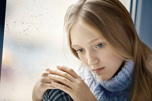 istock Rainy Day: sad Girl on the Window 175241447