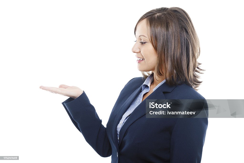 Businesswoman pointing Businesswoman pointing with a finger isolated on white background Adult Stock Photo