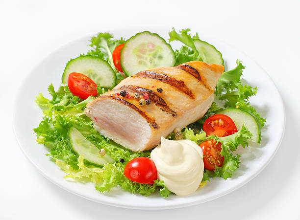 istock grilled chicken breast with vegetable garnish 175241500
