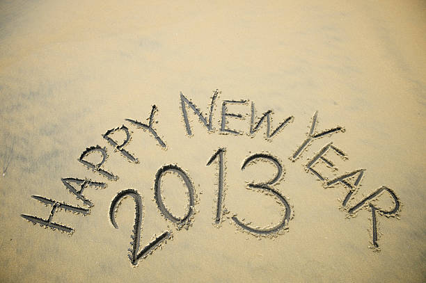 Happy New Year 2013 message in smooth sand