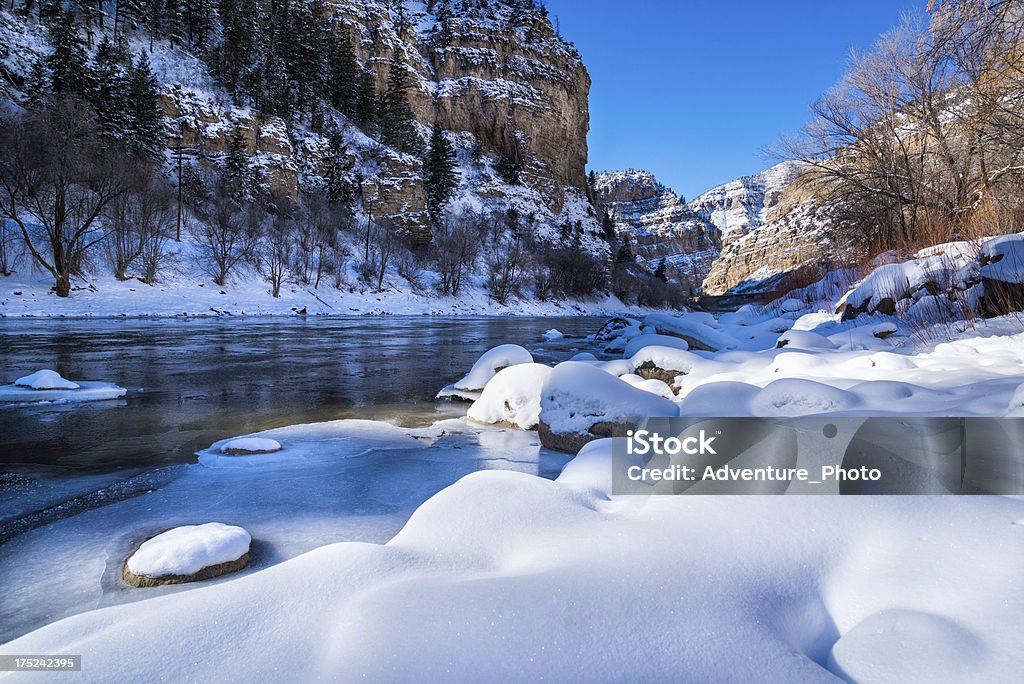 Glenwood Canyon Scenic Area in Winter "Area near Glenwood Springs, Colorado with Colorado River flowing through rugged scenic canyon.  View from river with fresh winter snow.  Captured as a 14-bit Raw file. Edited in 16-bit ProPhoto RGB color space." Winter Stock Photo