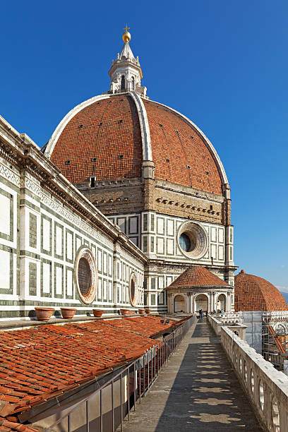 Brunelleschi's Dome Brunelleschi's Dome - shot taken from the roof of the Cathedral of Florence - a few unrecognizable tourists are visible in the background. filippo brunelleschi stock pictures, royalty-free photos & images