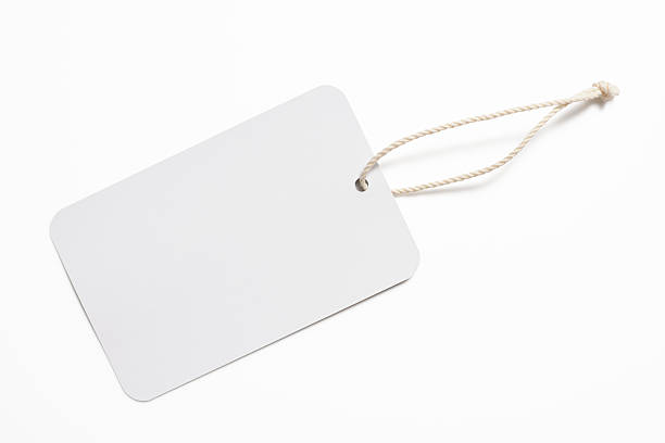 Isolated shot of blank white tag on white background Blank white tag isolated on white background with clipping path. price tag photos stock pictures, royalty-free photos & images