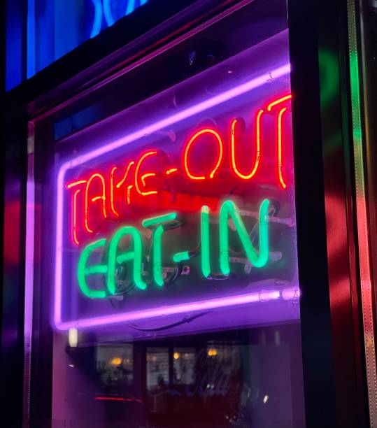 istock Take out or dine in neon sign is displayed at a restaurant 1752427599