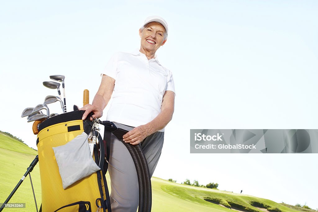 Golf la mantiene in forma e in salute - Foto stock royalty-free di Abbigliamento sportivo