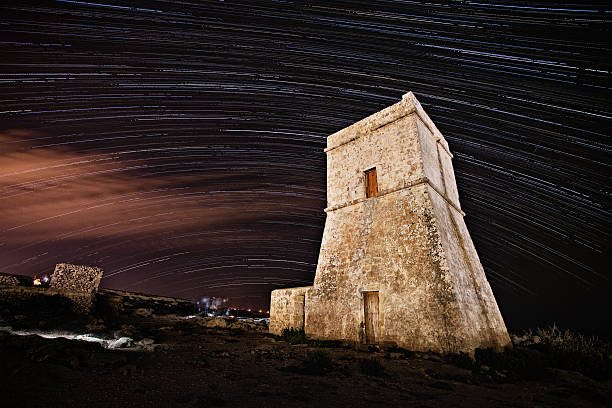 istock Star Trails over a coastal watch tower 175243690