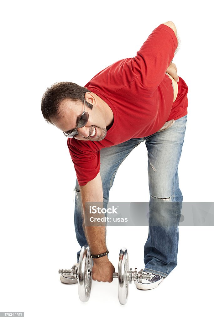 Man Lifting Weight Caucasian Adult. Focus is on face. Adult Stock Photo