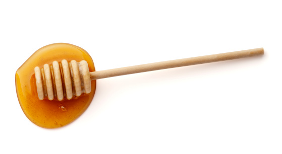 Aerial shot of honey dipper with honey spill.  Please see my portfolio for other food and drink related images.