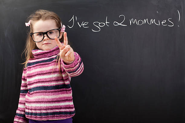 istock Cute girl has two mothers 175245011