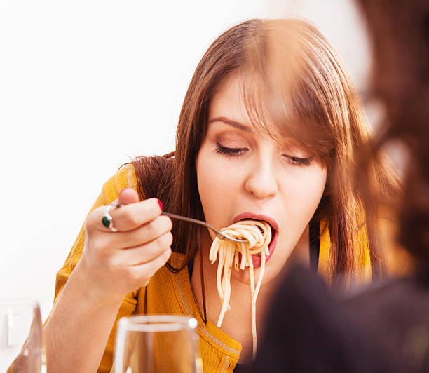 istock Girl eating pasta 175245158