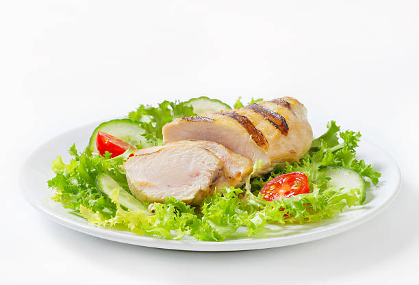 istock grilled chicken breast with vegetable garnish 175245699