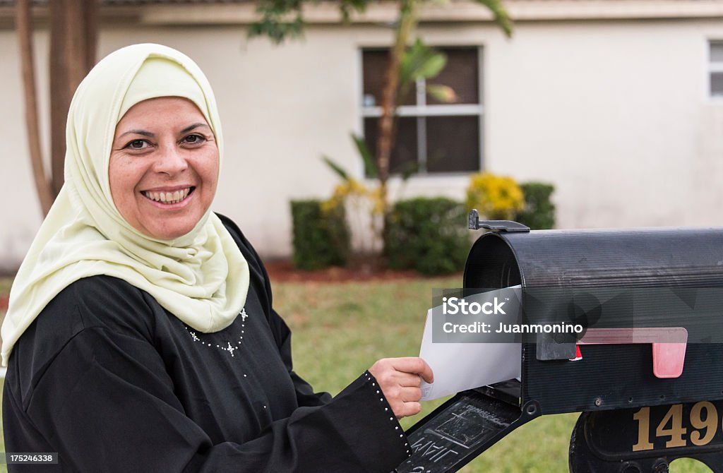 Middle eastern woman close up picture of a smiling mid adult middle eastern muslim woman wearing a veil outdoors (this picture have been shot with a Hasselblad HD3 II 31 megapixels) 30-39 Years Stock Photo