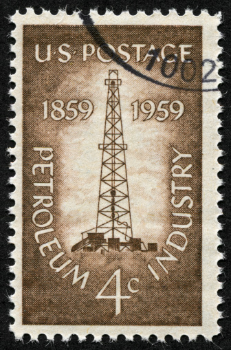 Cancelled United States of America 4 cent stamp honoring the petroleum industry from 1959.