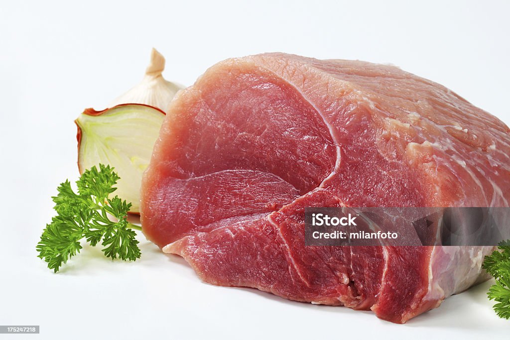 Raw beef shoulder with onion and garlic Affectionate Stock Photo