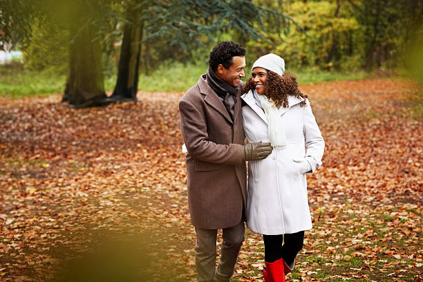 Portrait of African pregnant couple together in park