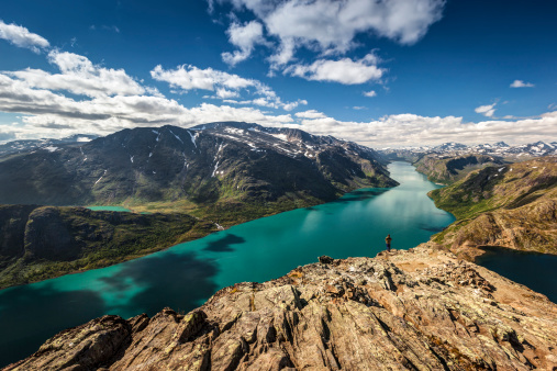 View from the highest point of the famous Beseggen Trail in Norway (Jotunheimen) with admirer