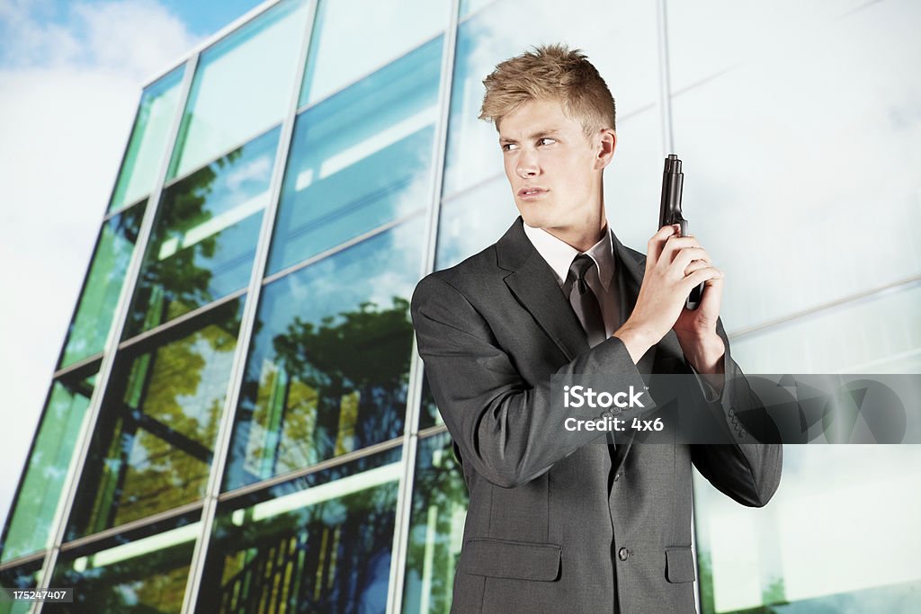 Secret agent with building in the background Building Exterior Stock Photo