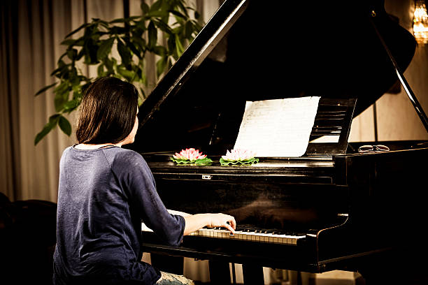 istock Woman Playing Piano 175247450