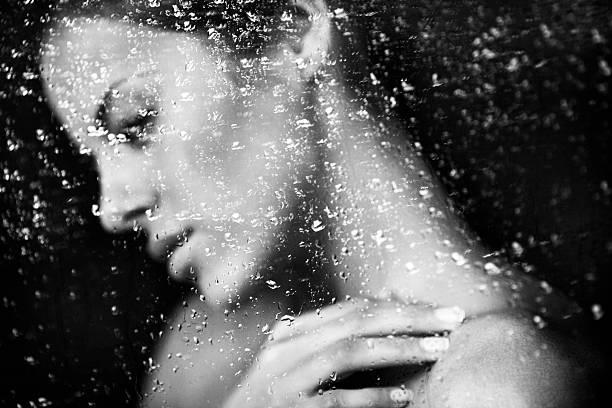 istock beautiful girl behind a window 175247647