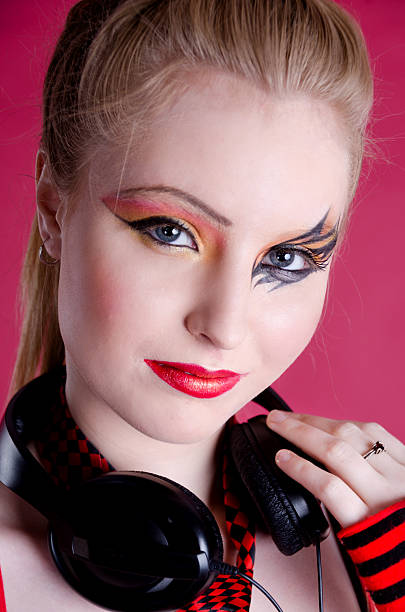 istock Young woman with interesting makeup and headphones 175247793
