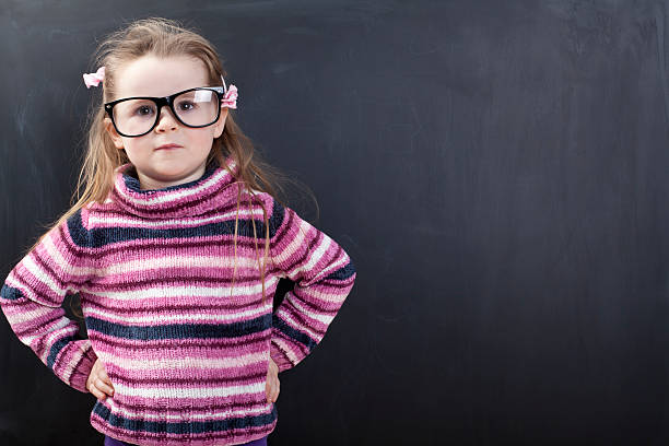 istock Cute girl in front of a chalkboard 175247839