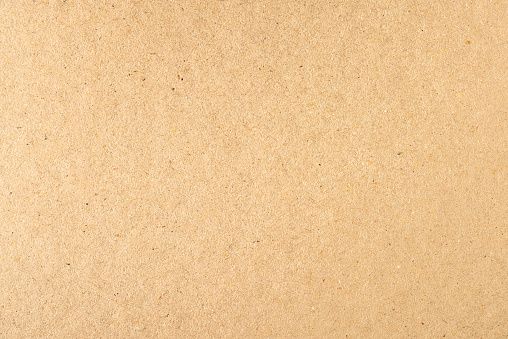 Macro image showing the random fibre pattern of a large section of blank cardboard.