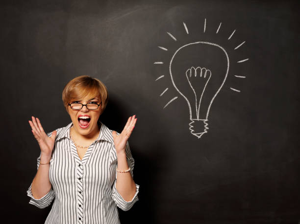 istock Stressed Businesswomen and a Chalk Sketched Lightbulb 175248582