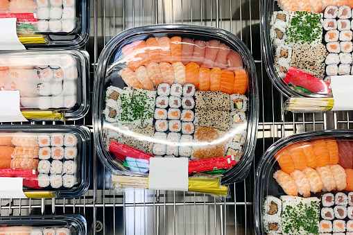 Sushi in plastic trays for sale in a supermarket