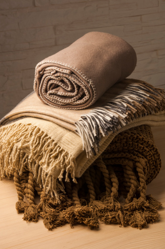 decorative cozy stacked blankets