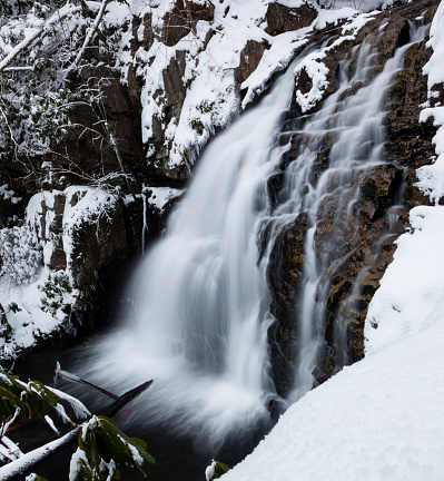Hawk waterfall under snow. Pocono mountains, Pennsylvania, USA