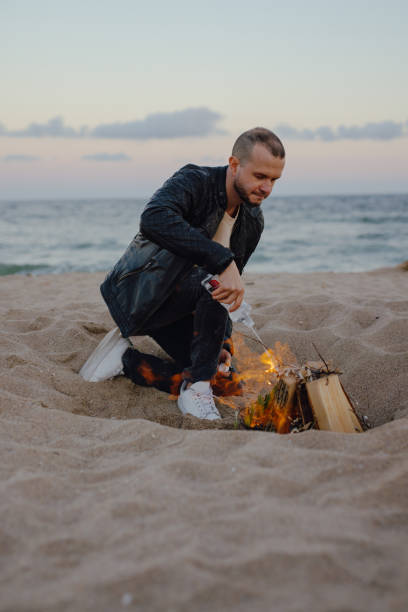 istock Man make a campfire near the sea at evening 1752500595