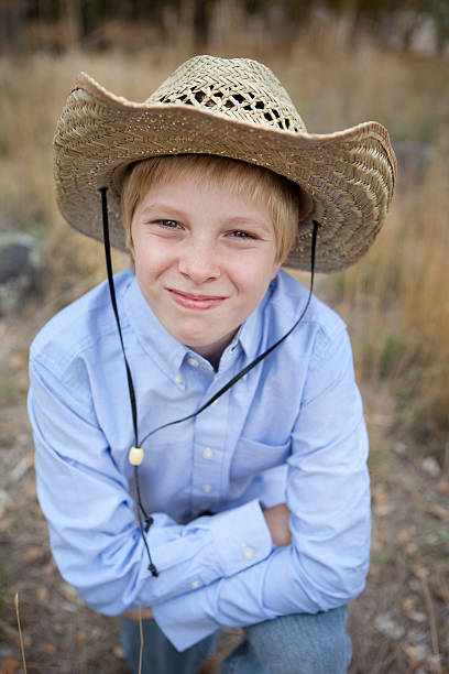 istock Pre Adolescent Boy Wearing Cowboy Hat 175250853