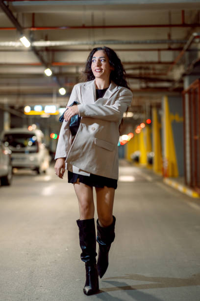 istock Businesswoman walking in parking garage after work 1752509143