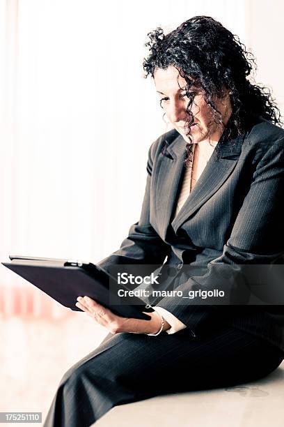 Businesswoman Using A Digital Tablet Stock Photo - Download Image Now - 30-39 Years, 40-49 Years, Adult
