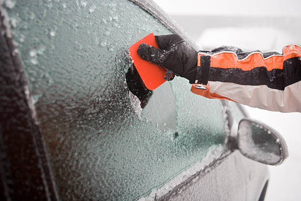 Scraping ice frozen car is freed of its ice on the windows icecap photos stock pictures, royalty-free photos & images