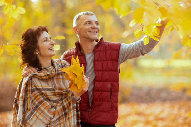 istock smiling romantic boyfriend and girlfriend in park walking 1752520519
