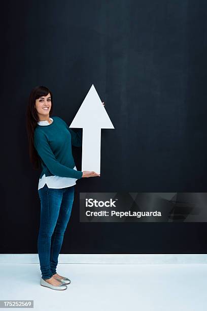 Woman Pointing Up Stock Photo - Download Image Now - 20-24 Years, Achievement, Adult