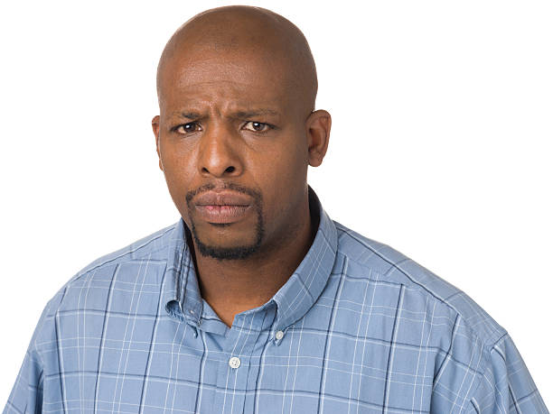 Frowning Concerned Man Portrait of a man on a white background. http://s3.amazonaws.com/drbimages/m/004cm.jpg frowning headshot close up studio shot stock pictures, royalty-free photos & images