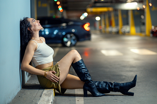 Young attractive model in parking garage