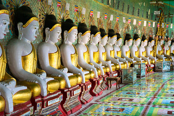 istock Buddha statues in a row, the Umin Thounzeh temple 175253424