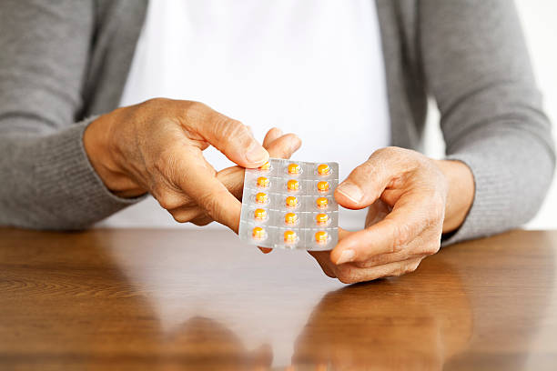 istock mature woman taking medication 175253446